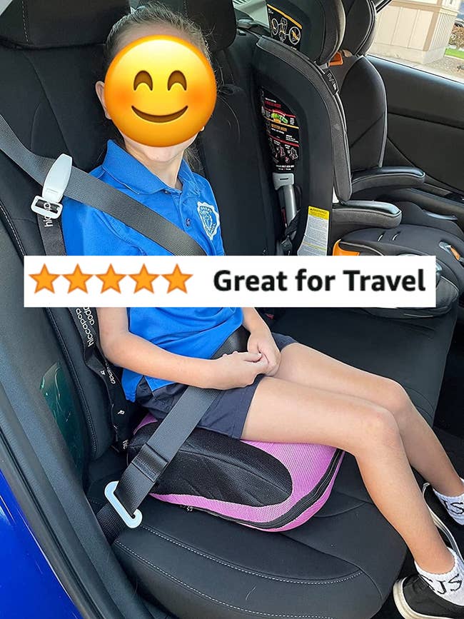 A child sitting on the inflatable booster seat while buckled in