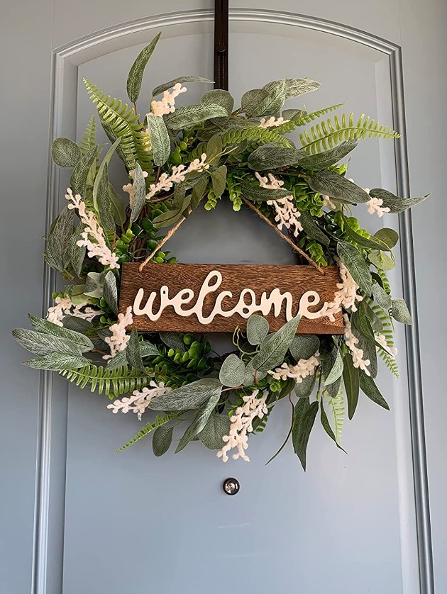 A reviewer&#x27;s photo of the wreath hung on their front door