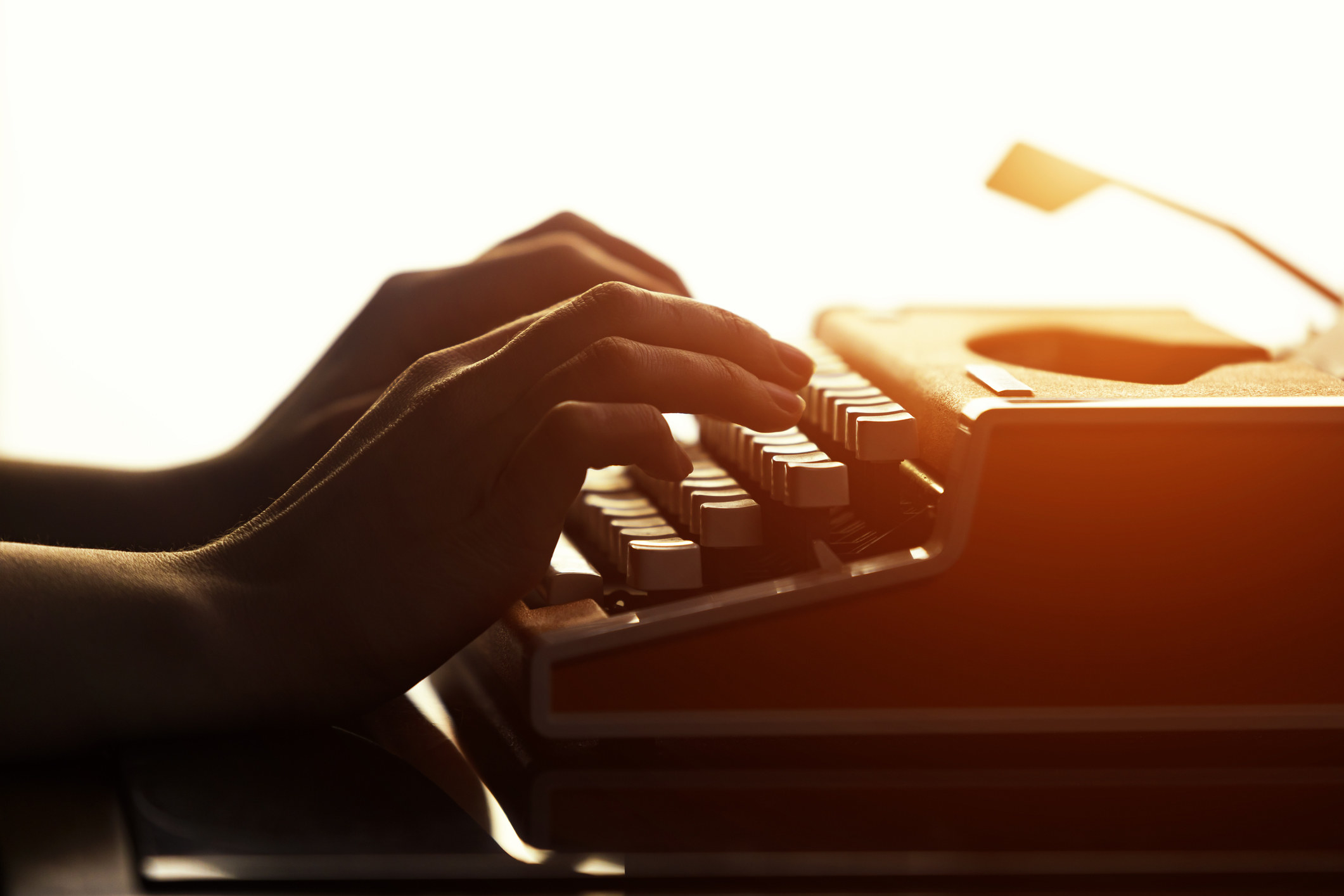 hands on a typewriter