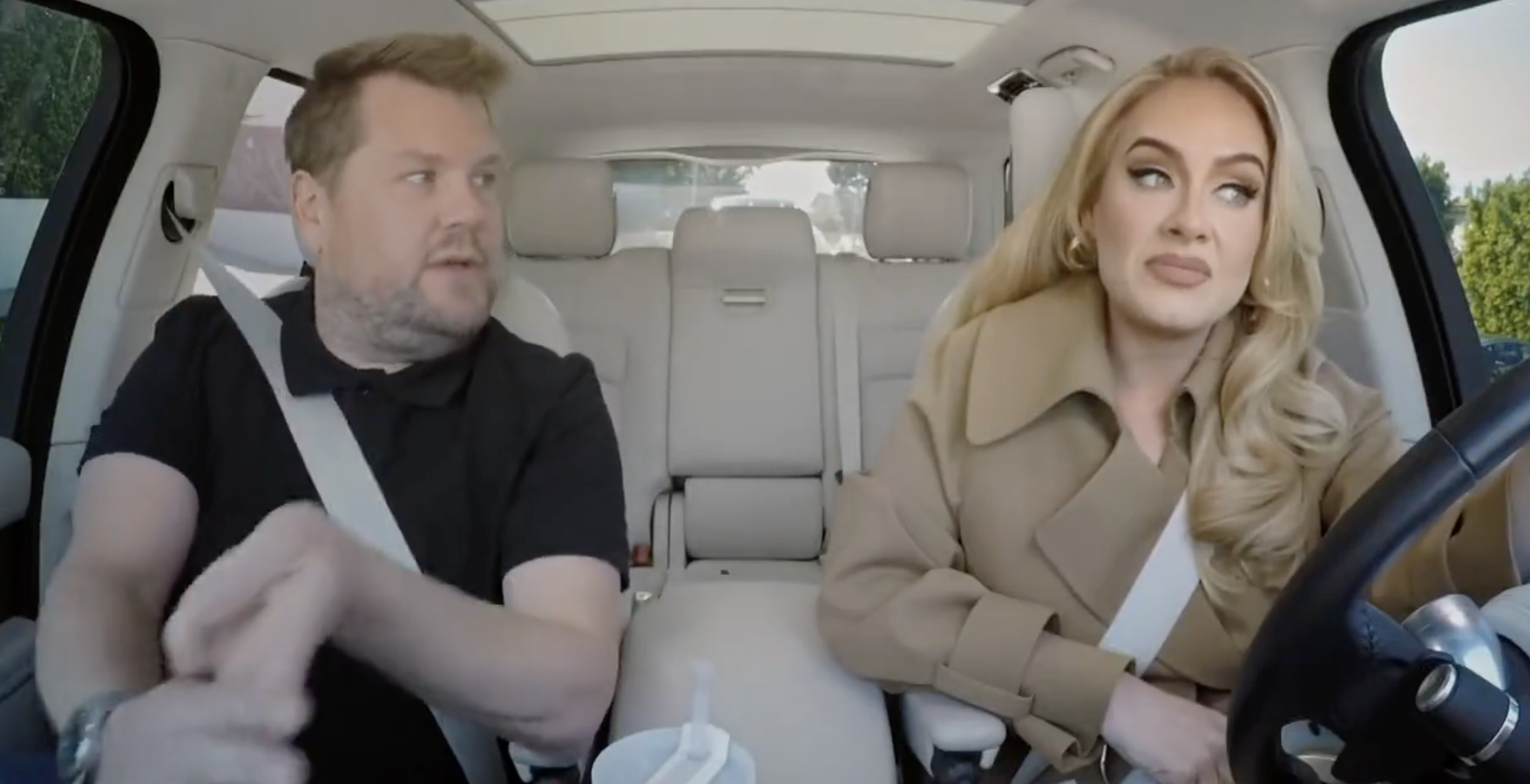 Adele driving as James sits in the passenger seat