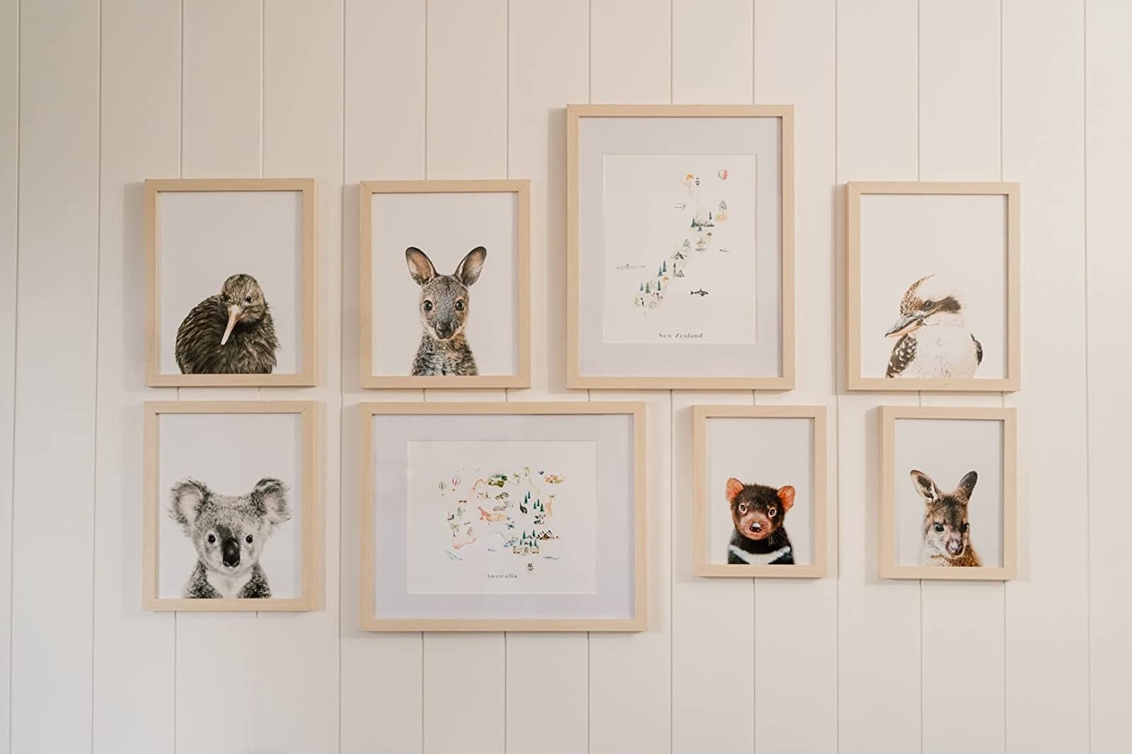 A reviewer&#x27;s photo of the frames hung with animal photos in them