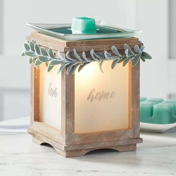 Large candle warmer on a table