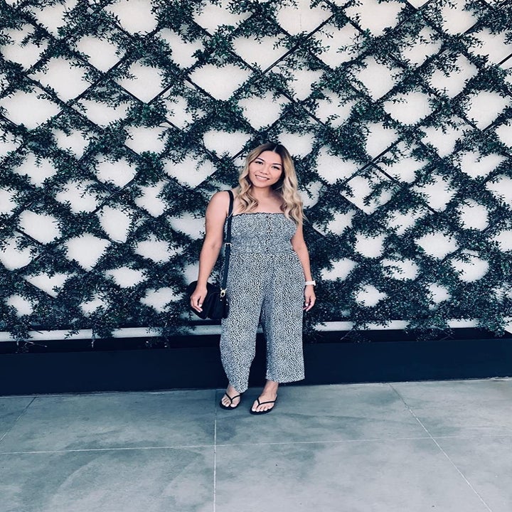 Reviewer wearing the black and white jumpsuit