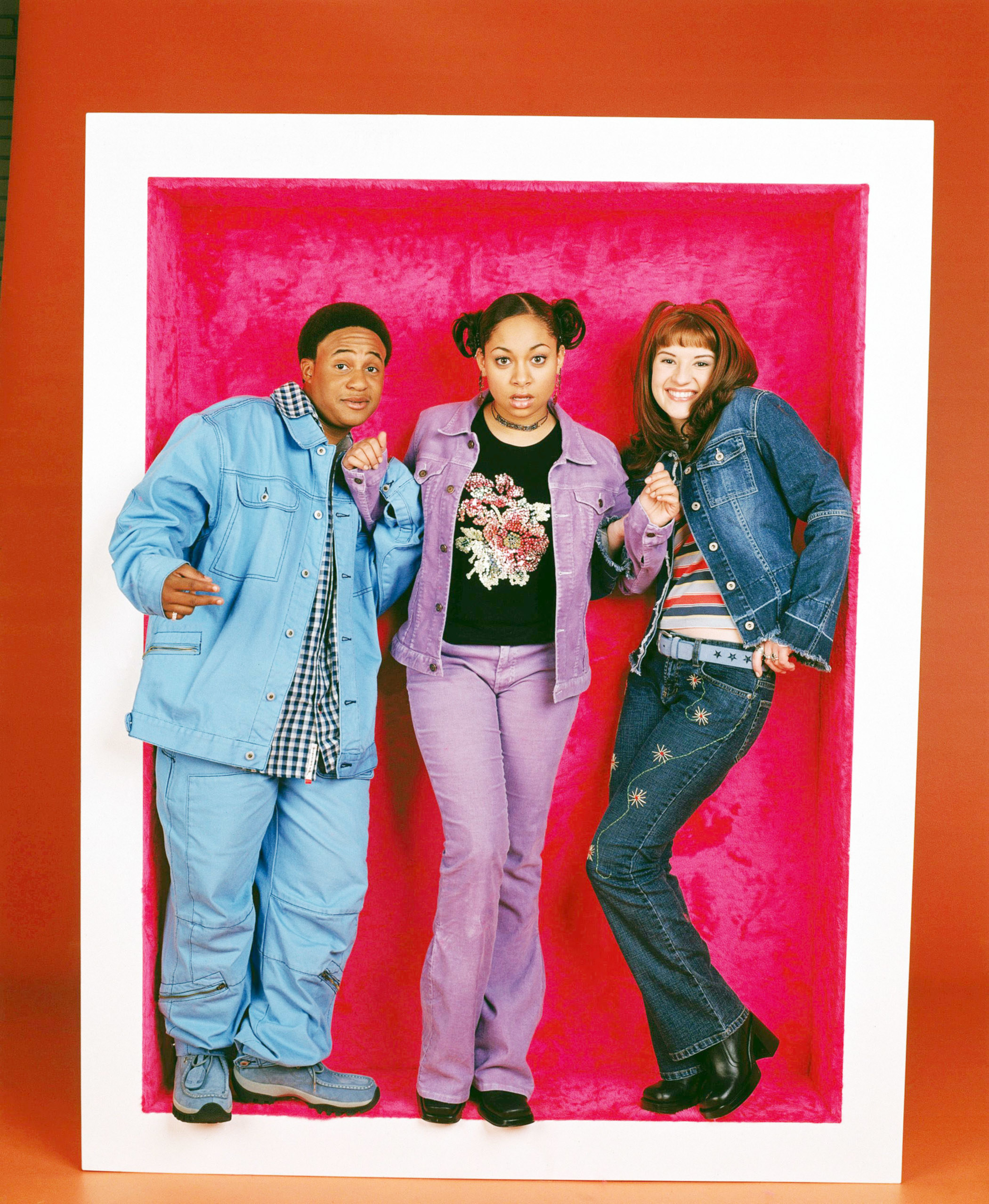 From left to right: Orlando Brown, Raven, and Anneliese posing for a promo pic for the show inside a life-sized frame