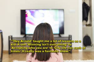 A little girl watches television