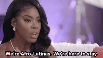 A woman saying &quot;we&#x27;re afro-latinas. We&#x27;re here to say.&quot;