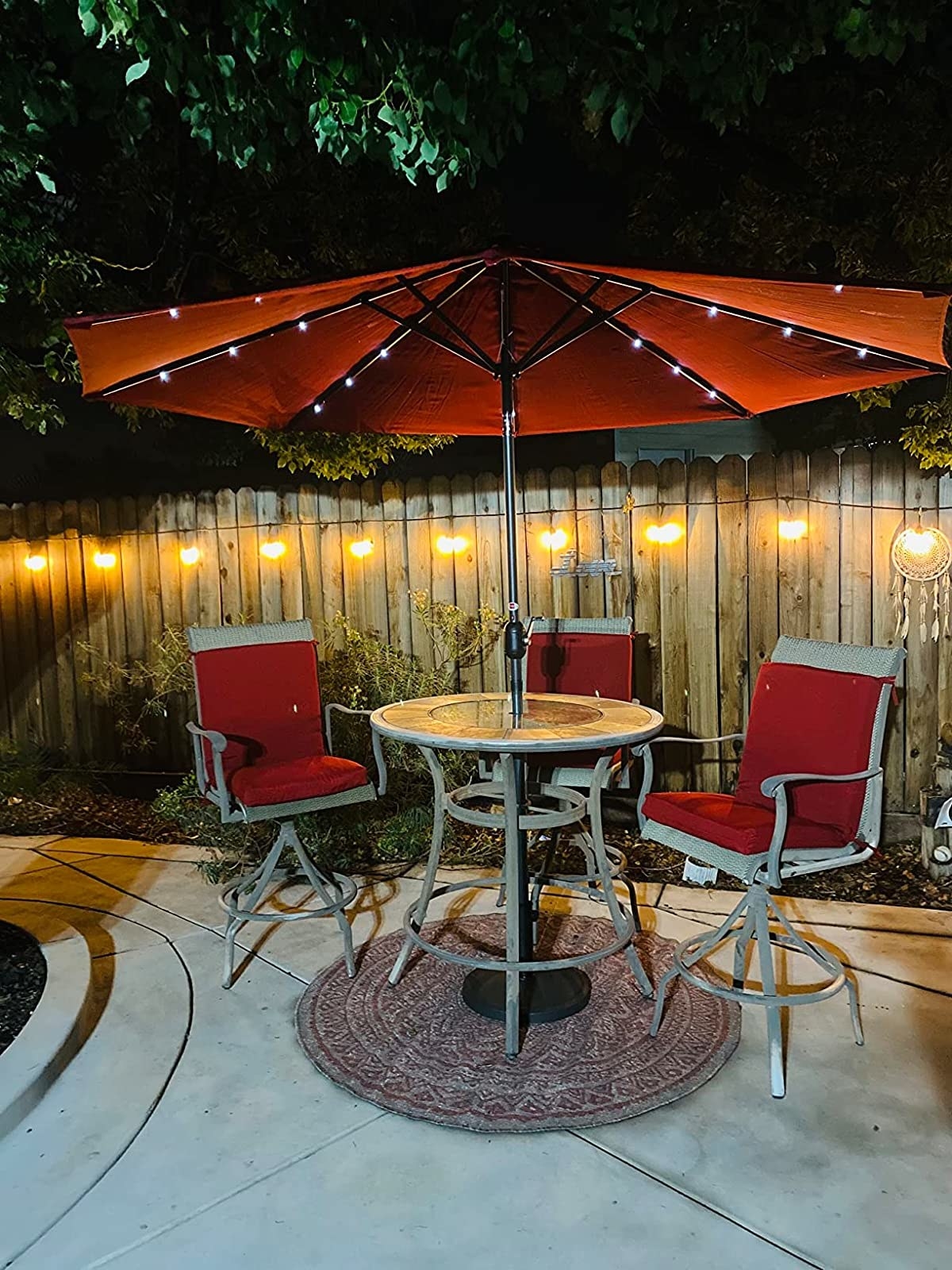 Reviewer image of their outdoor seating area with the umbrella