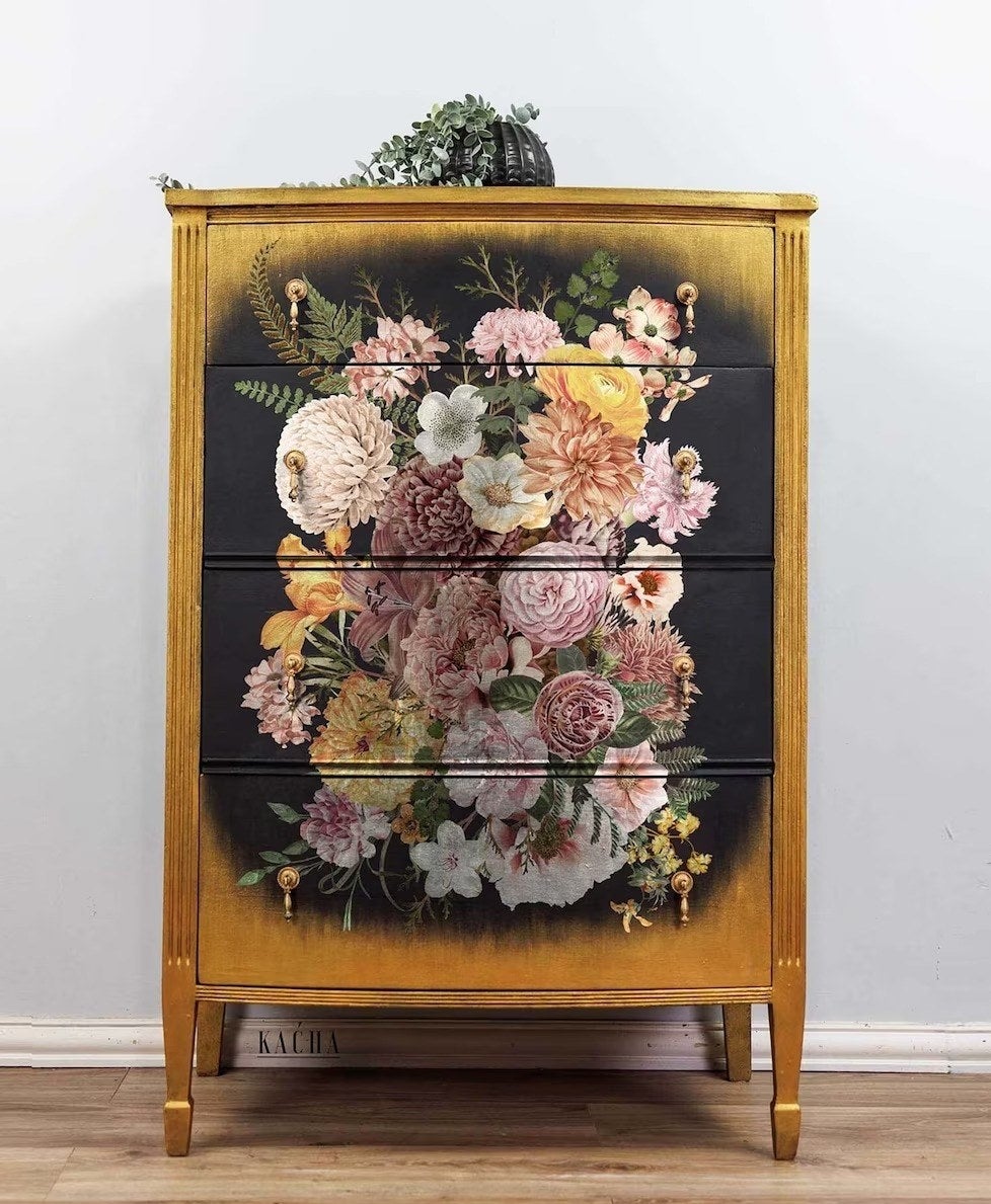 black chest of drawers with floral decals over the front of all the drawers, looking spectacular