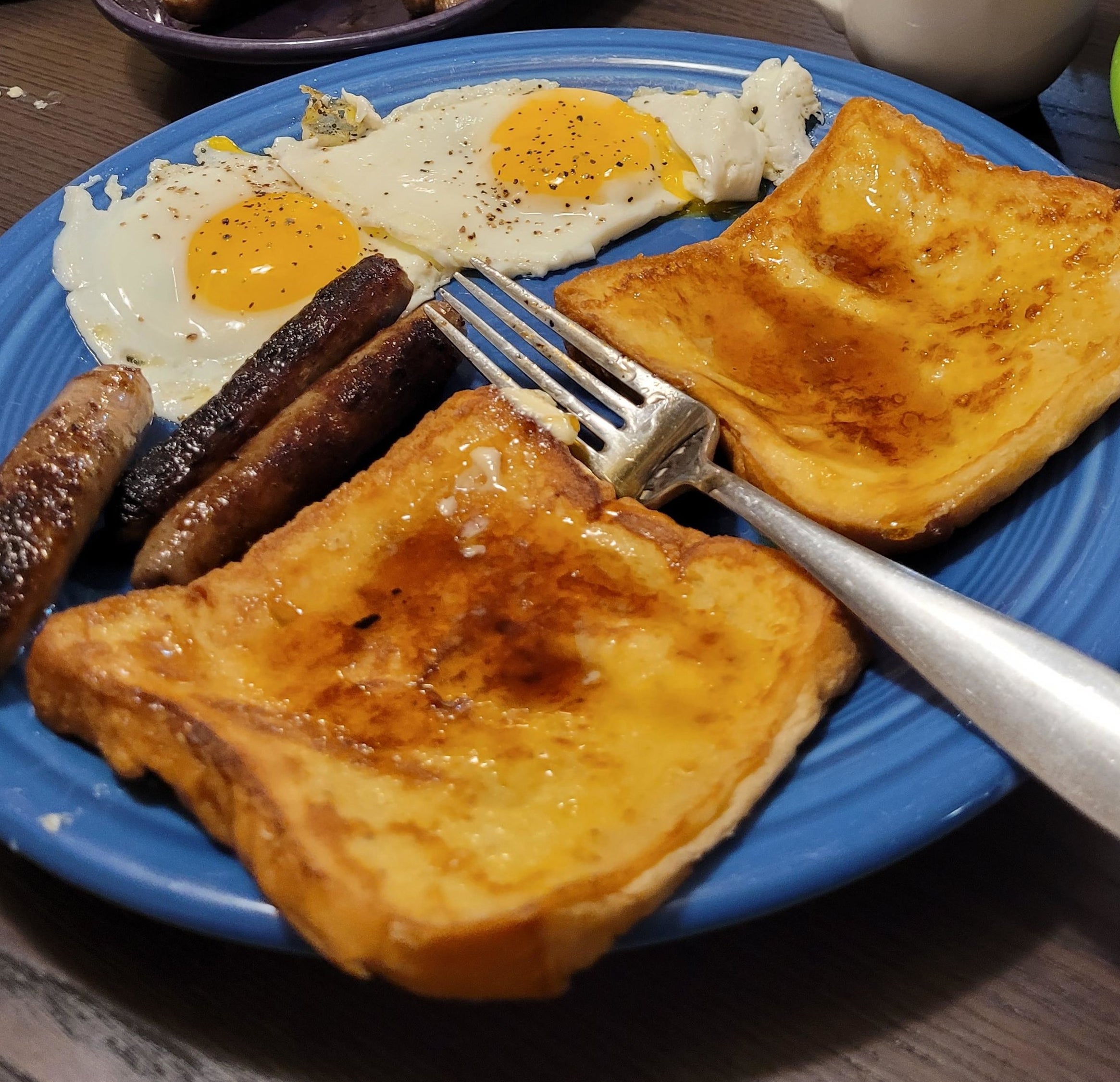 Breakfast for dinner with eggs, French toast, and sausage