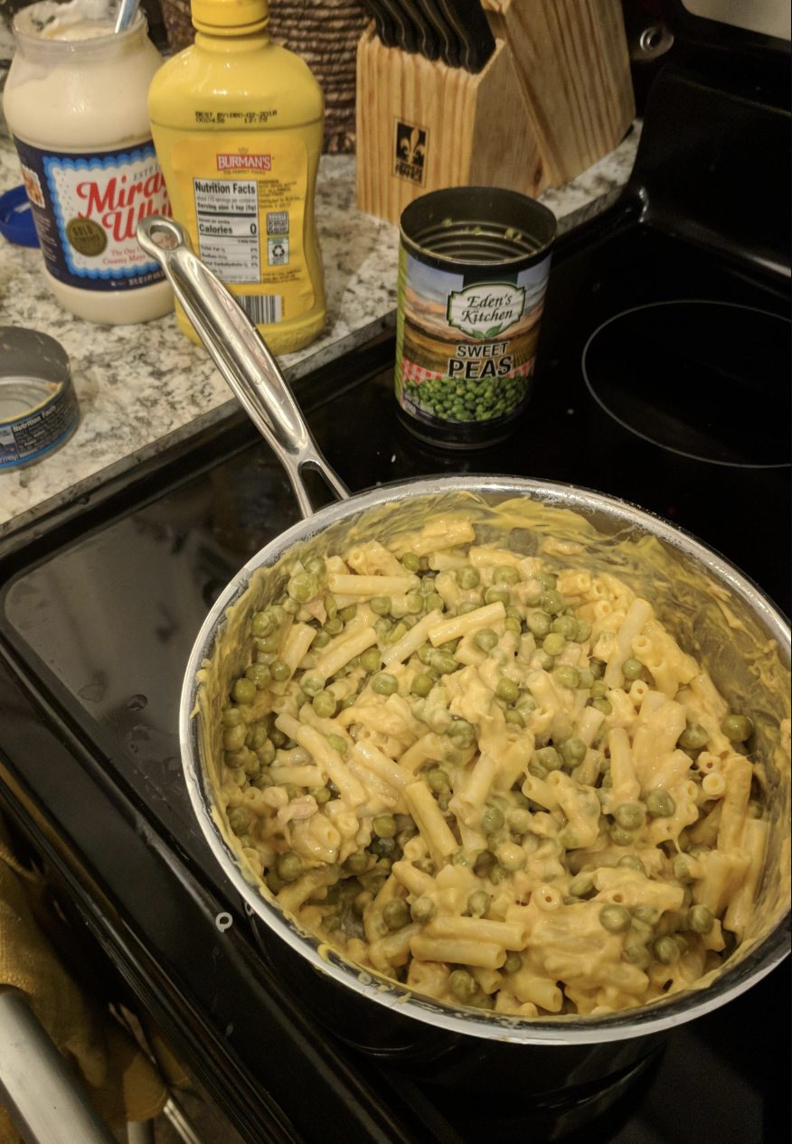 Tuna noodle bake with peas on the stove