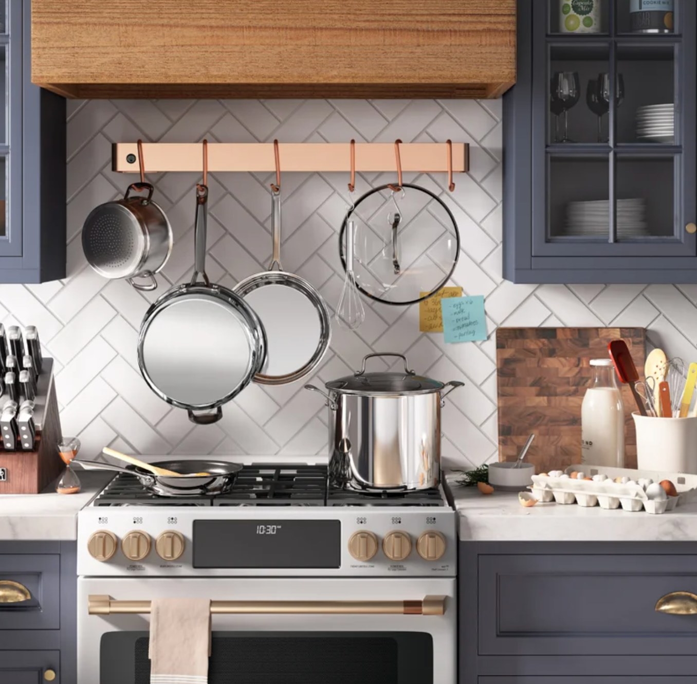 the silver pans and accessories in a decorated kitchen space