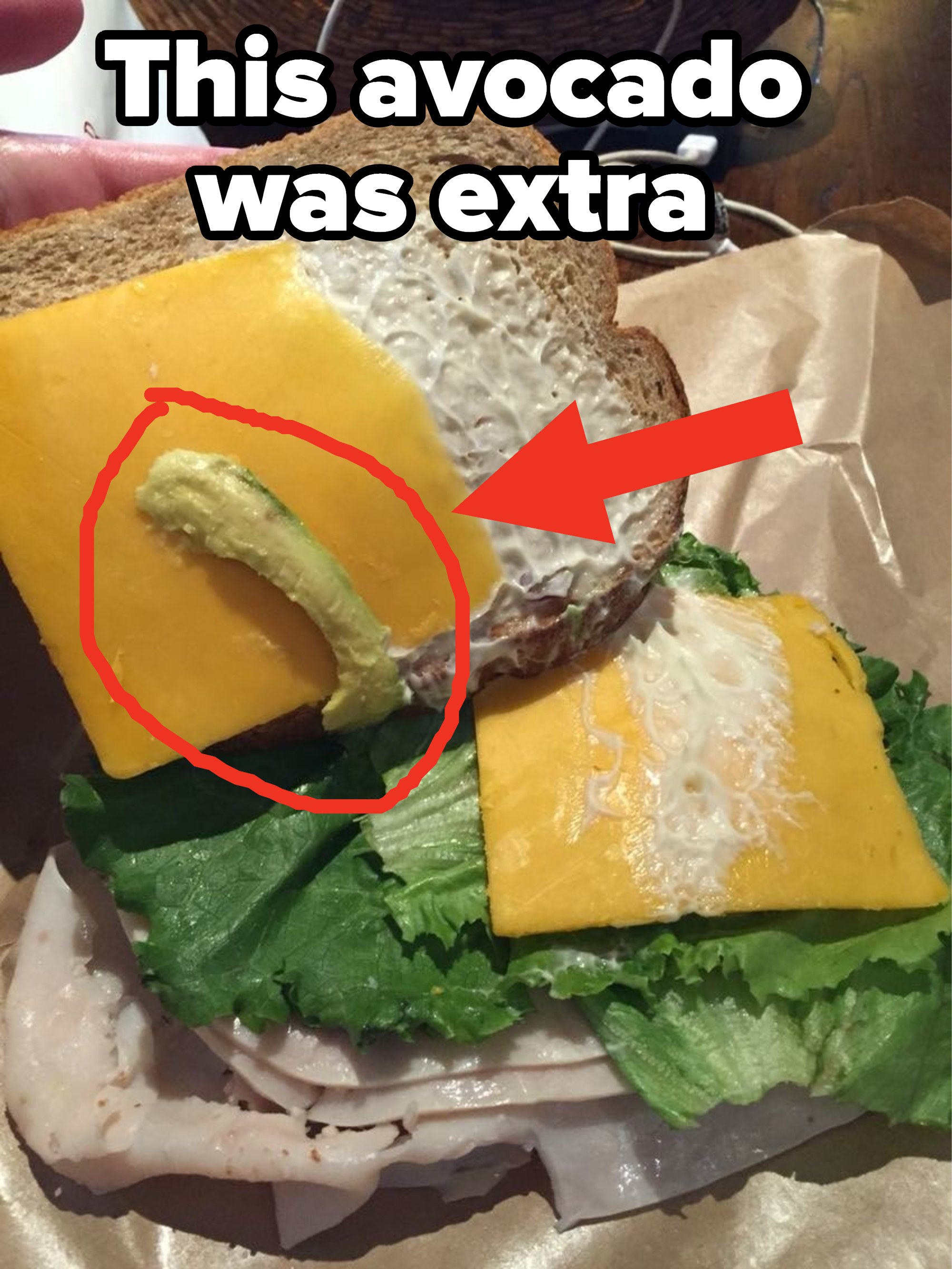 A small piece of avocado on a sandwich