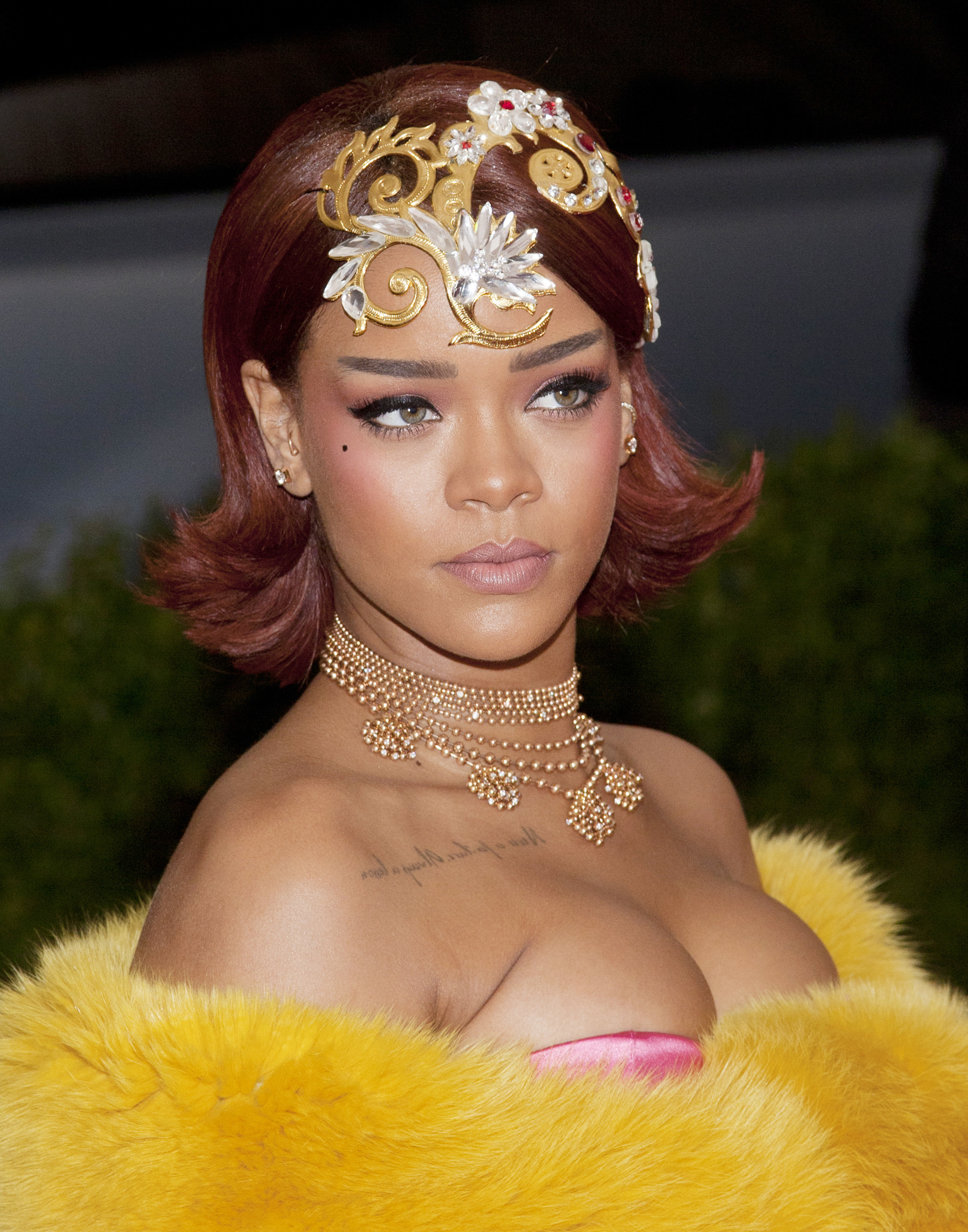 Close-up of Rihanna in bejeweled headband and necklace