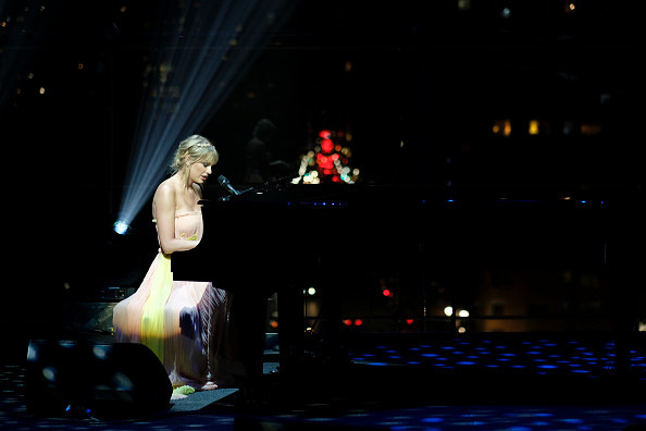 Taylor Swift playing the piano