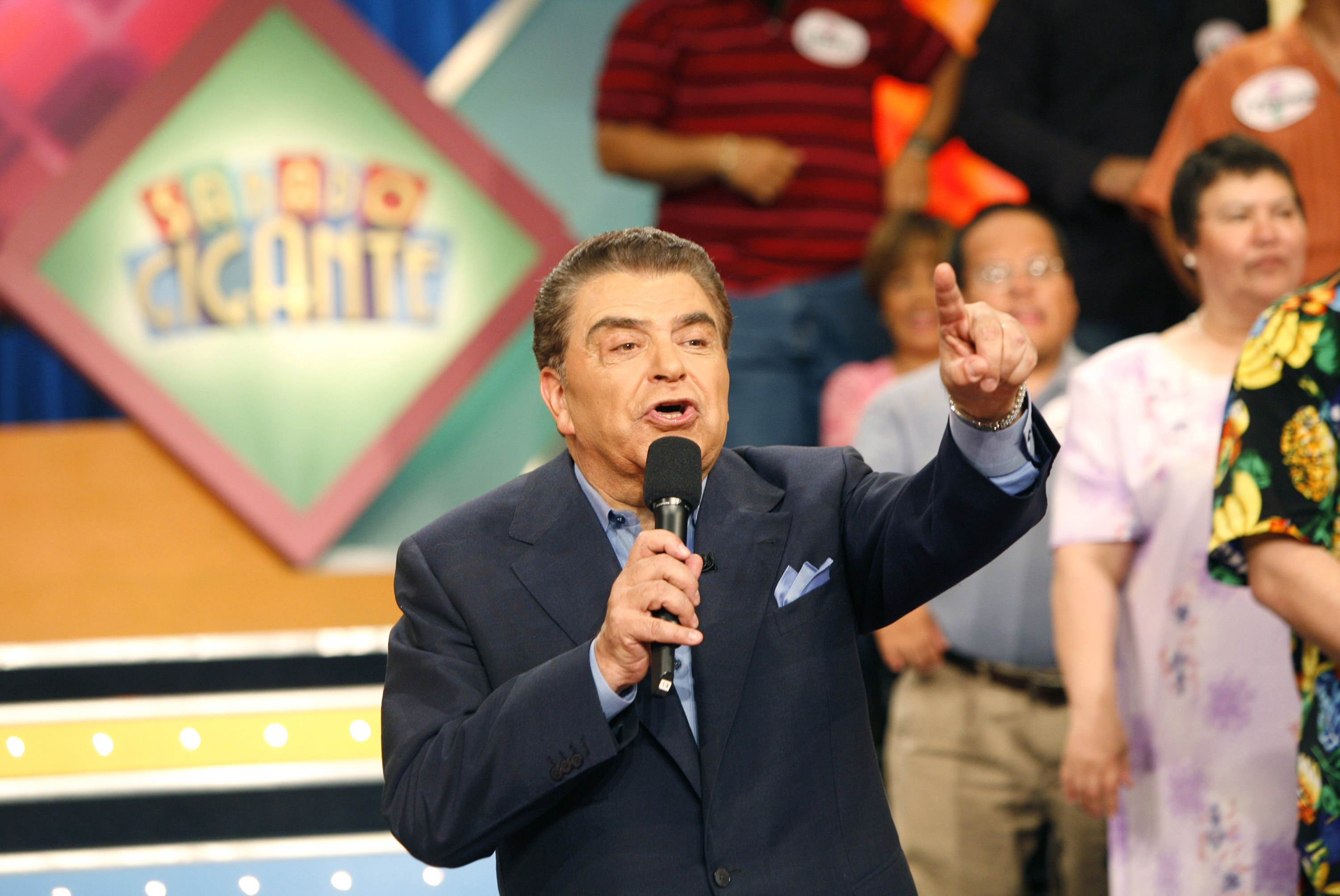 Don Francisco talking into a microphone