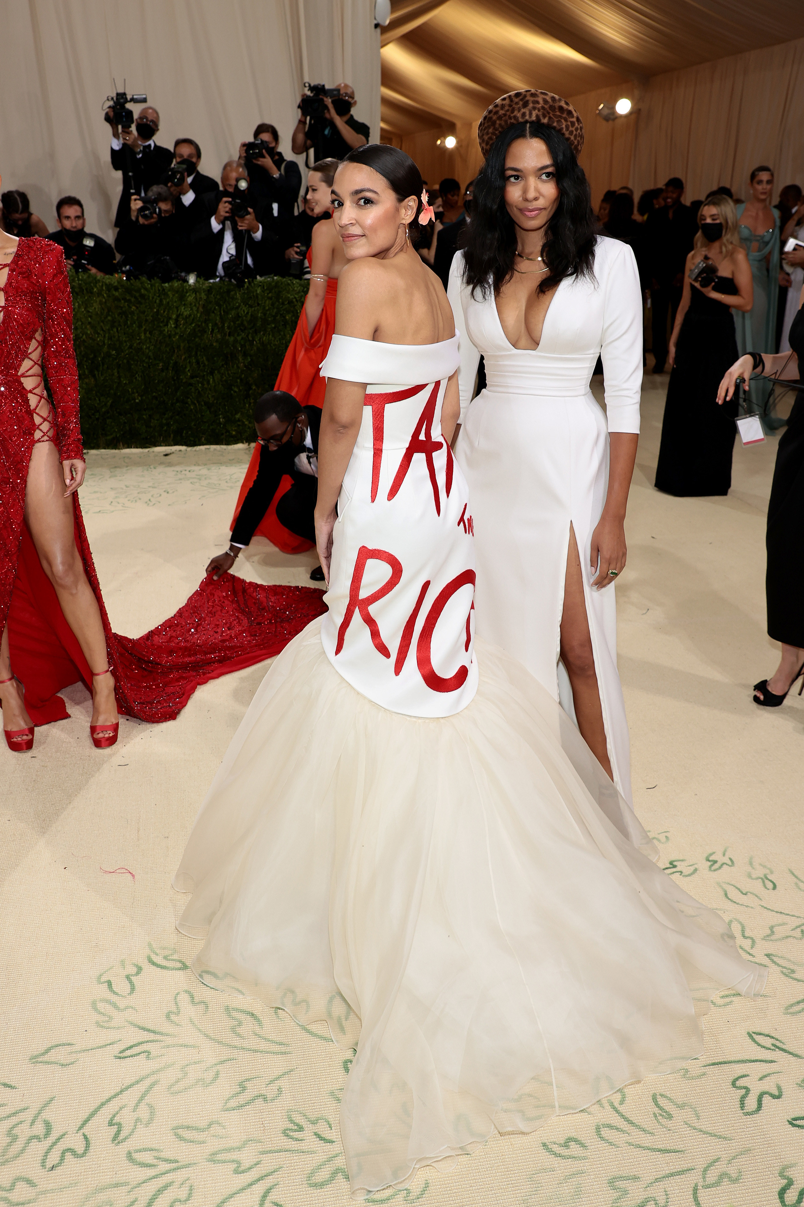 Alexandria Ocasio-Cortez and Aurora James attend the 2021 Met Gala Celebrating In America: A Lexicon of Fashion at the Metropolitan Museum of Art on Sept 13, 2021, in New York City