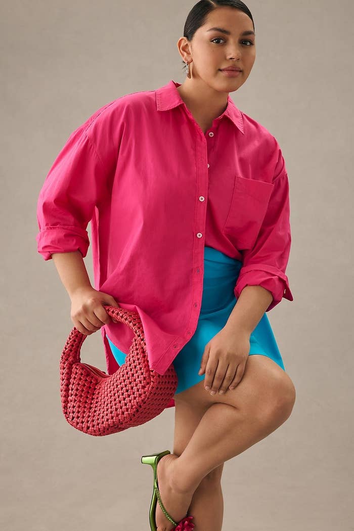 model in oversized hot pink button-up long sleeve collared shirt