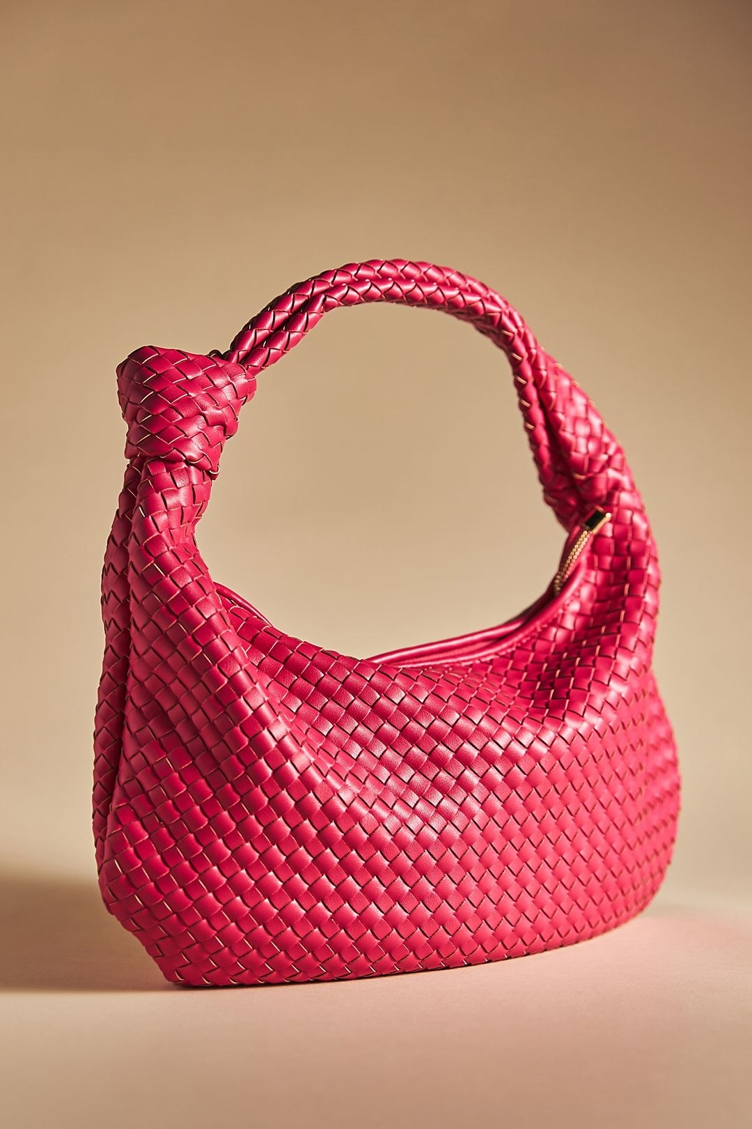 hot pink woven satchel bag with a knotted handle