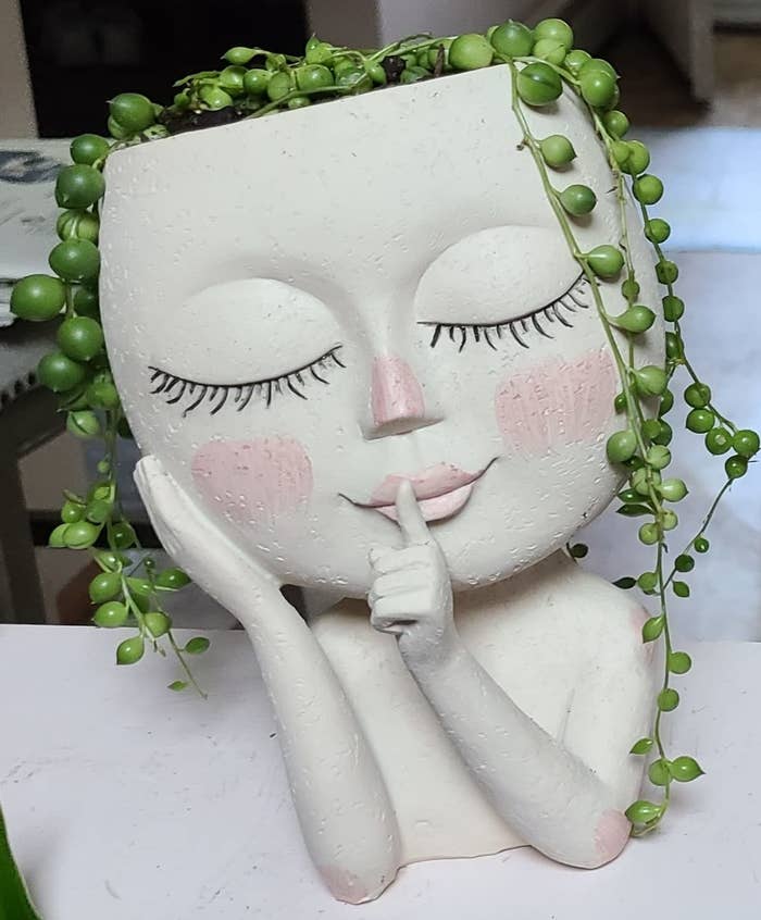 a reviewer&#x27;s face planter with string of pearls