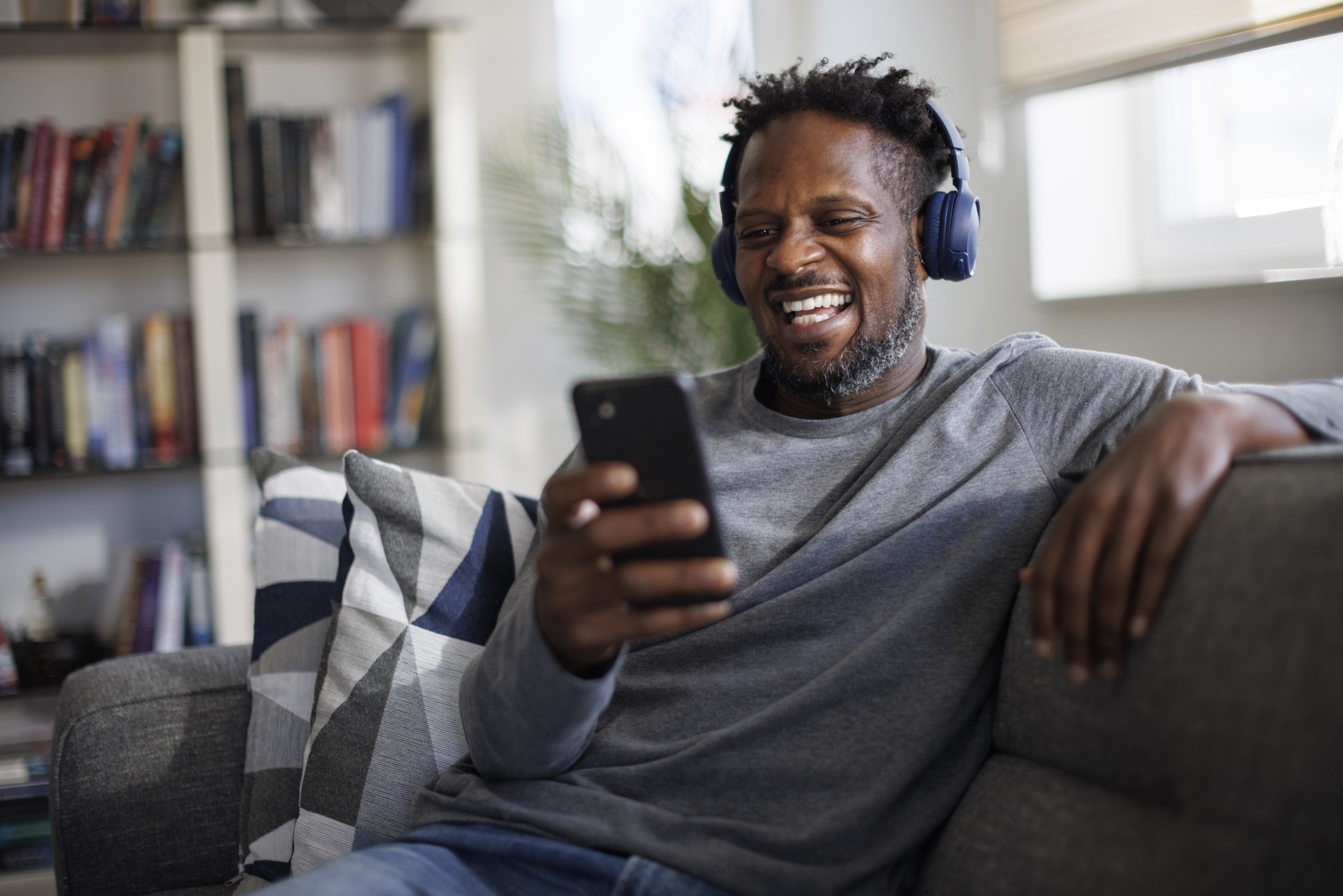 A man watching a funny video