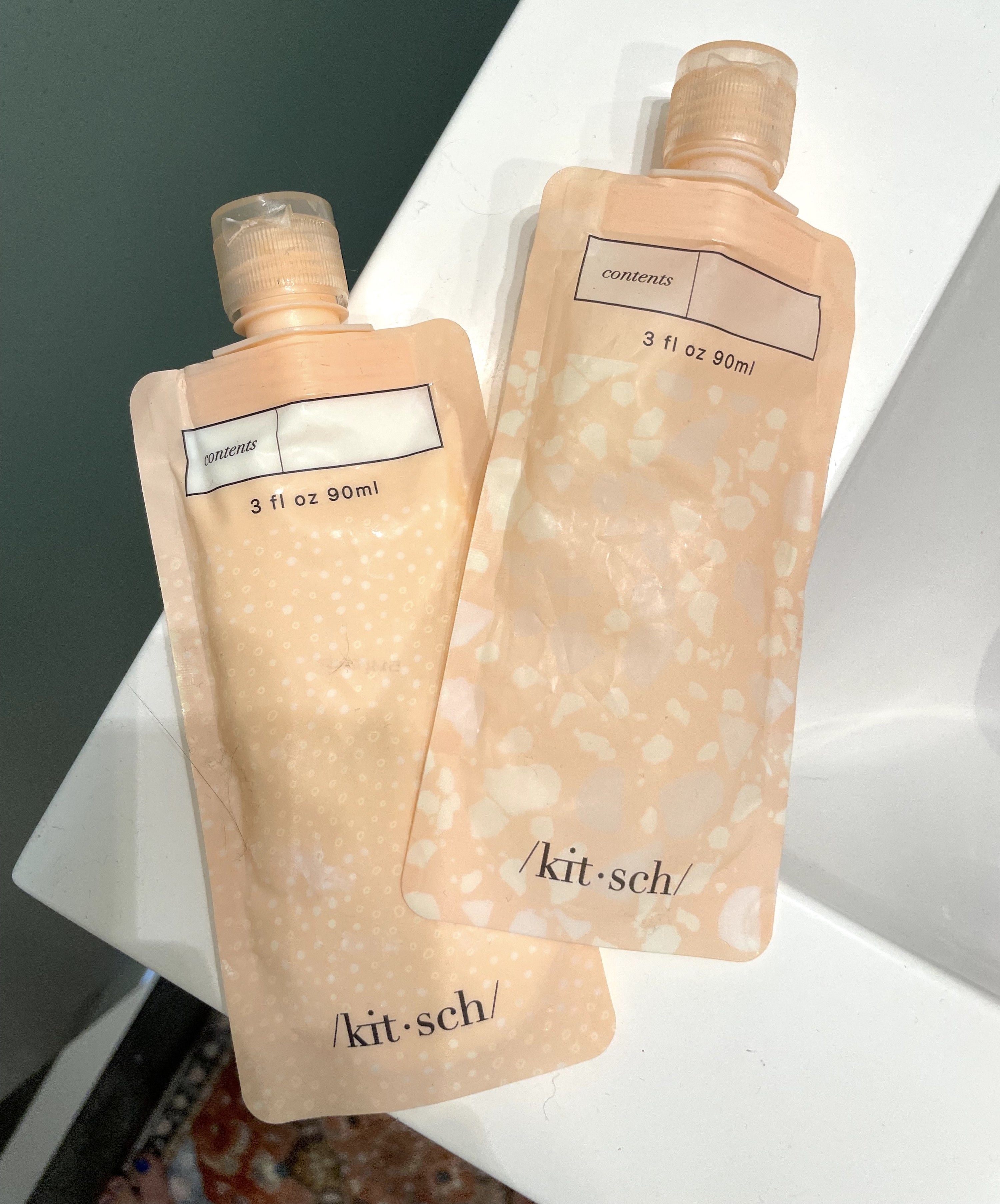 two Kitsch toiletry travel pouches on a BuzzFeeder&#x27;s bathroom counter