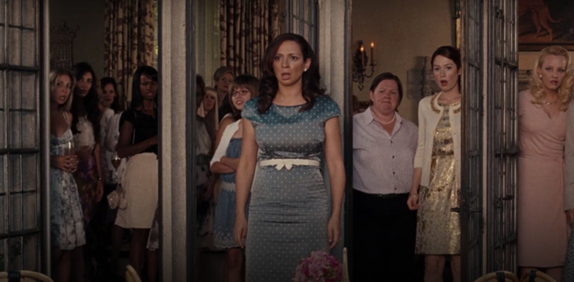 Maya Rudolph staring horrified toward Kristen Wigg in a scene from "Bridesmaids"