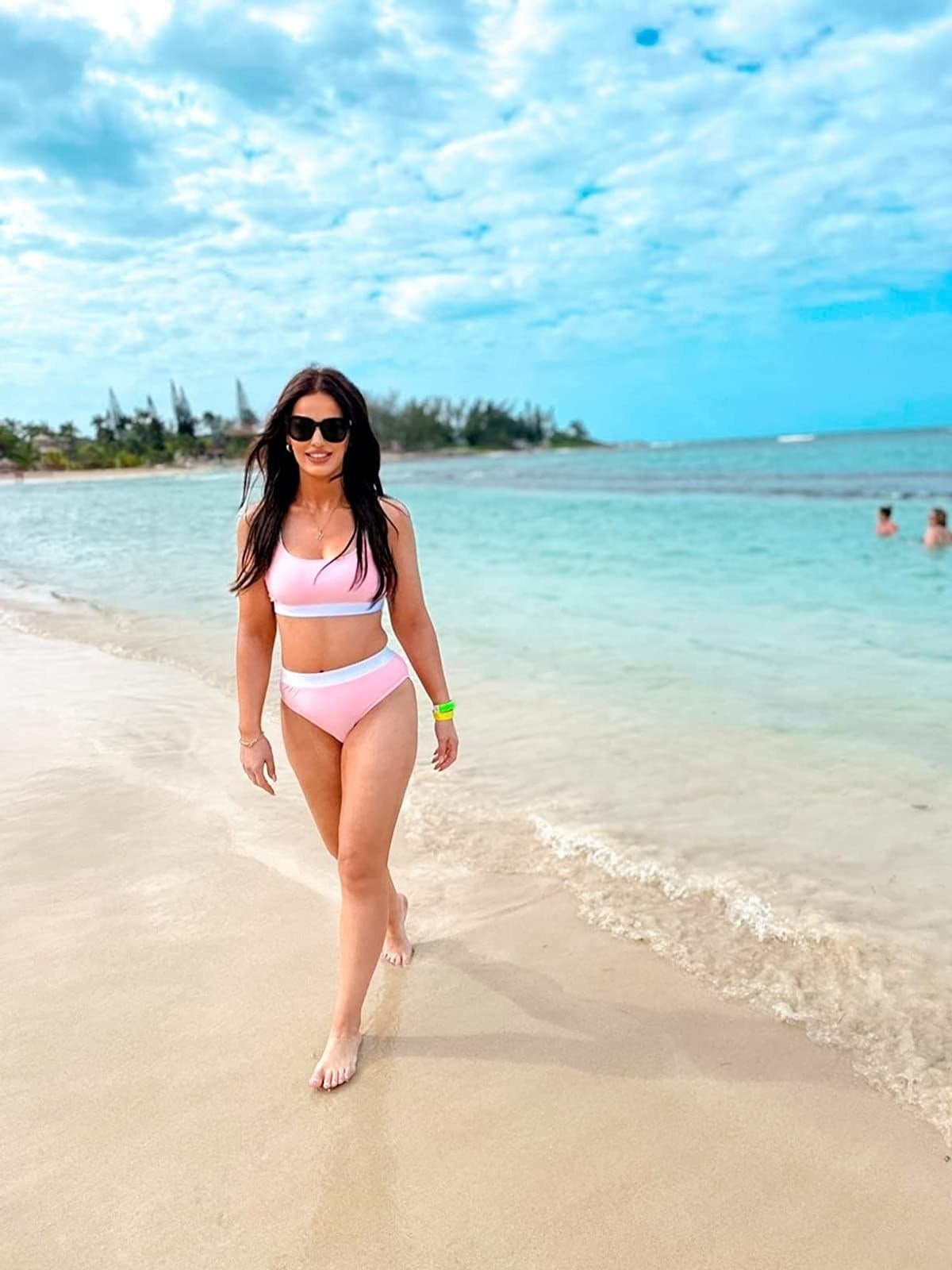 Image of reviewer wearing pink swimsuit