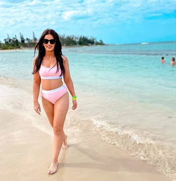 Image of reviewer wearing pink swimsuit