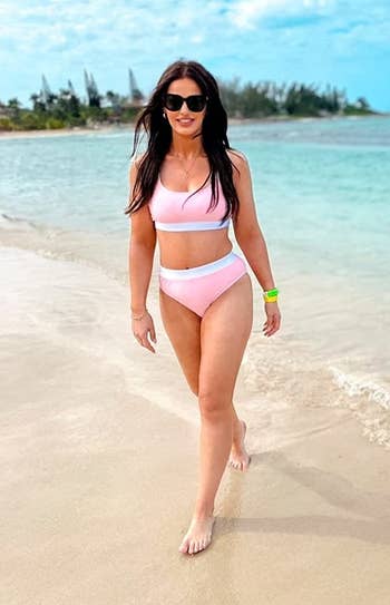 Image of reviewer wearing pink swimsuit
