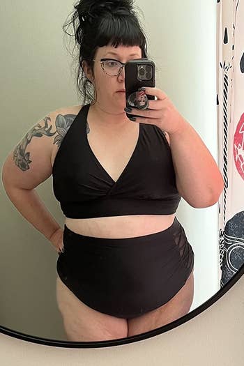 Image of reviewer wearing black swimsuit