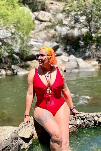 Image of reviewer wearing red swimsuit