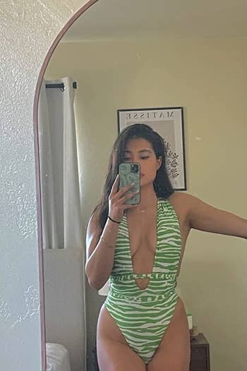 Image of reviewer wearing green swimsuit
