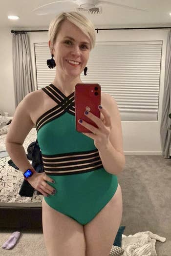 Image of reviewer wearing green swimsuit