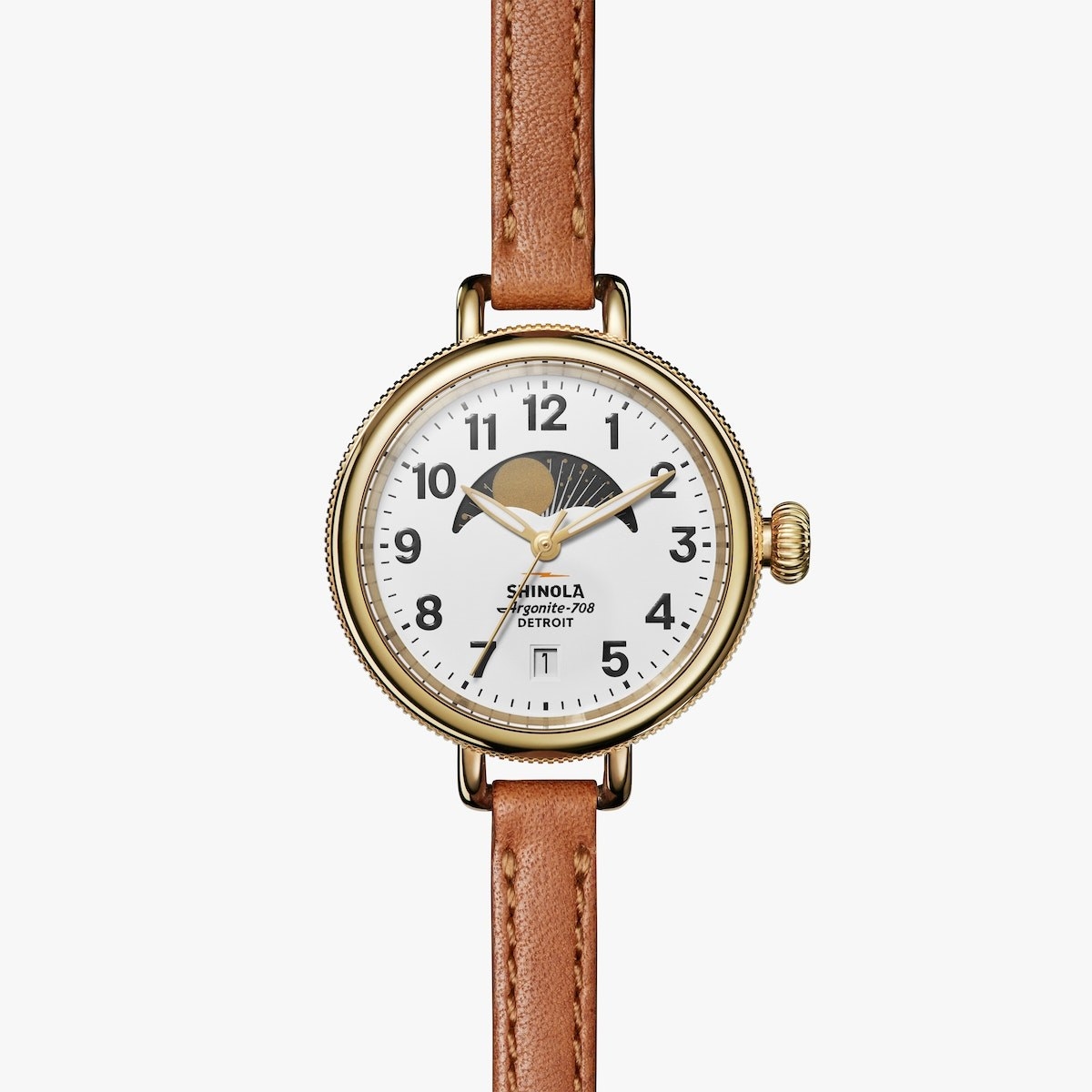 a gold watch with a white face and a thin tan leather band