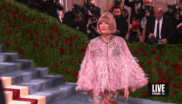 Anna Wintour walking across the red carpet