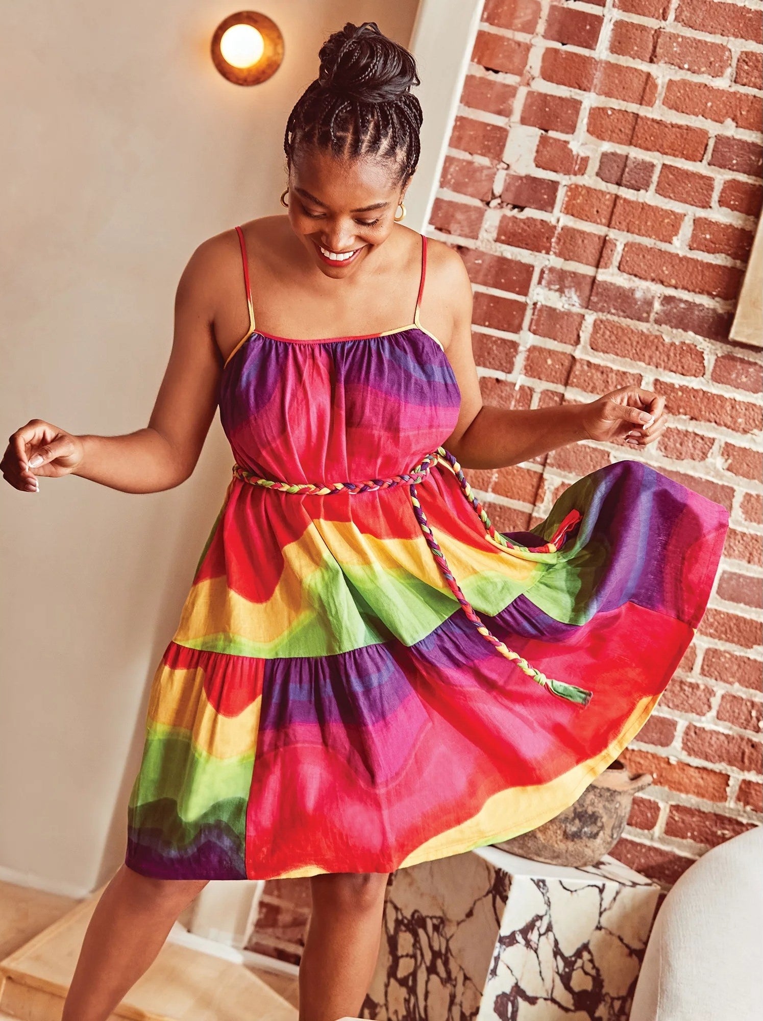 Model wears a colorful dress