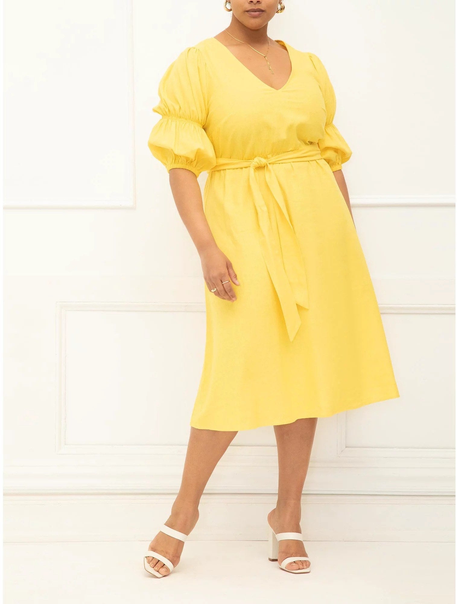 Model wears a tea length dress