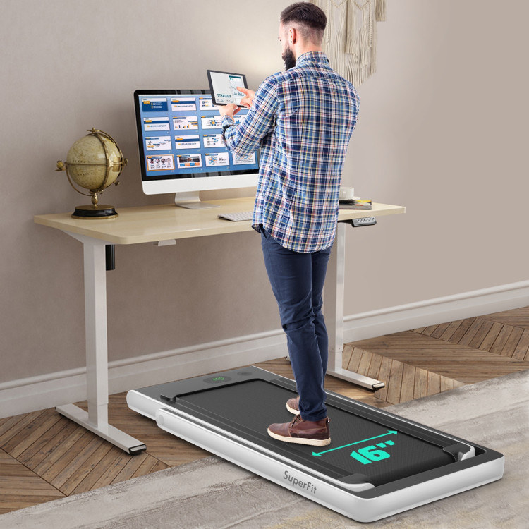 model walking on the white treadmill under his desk