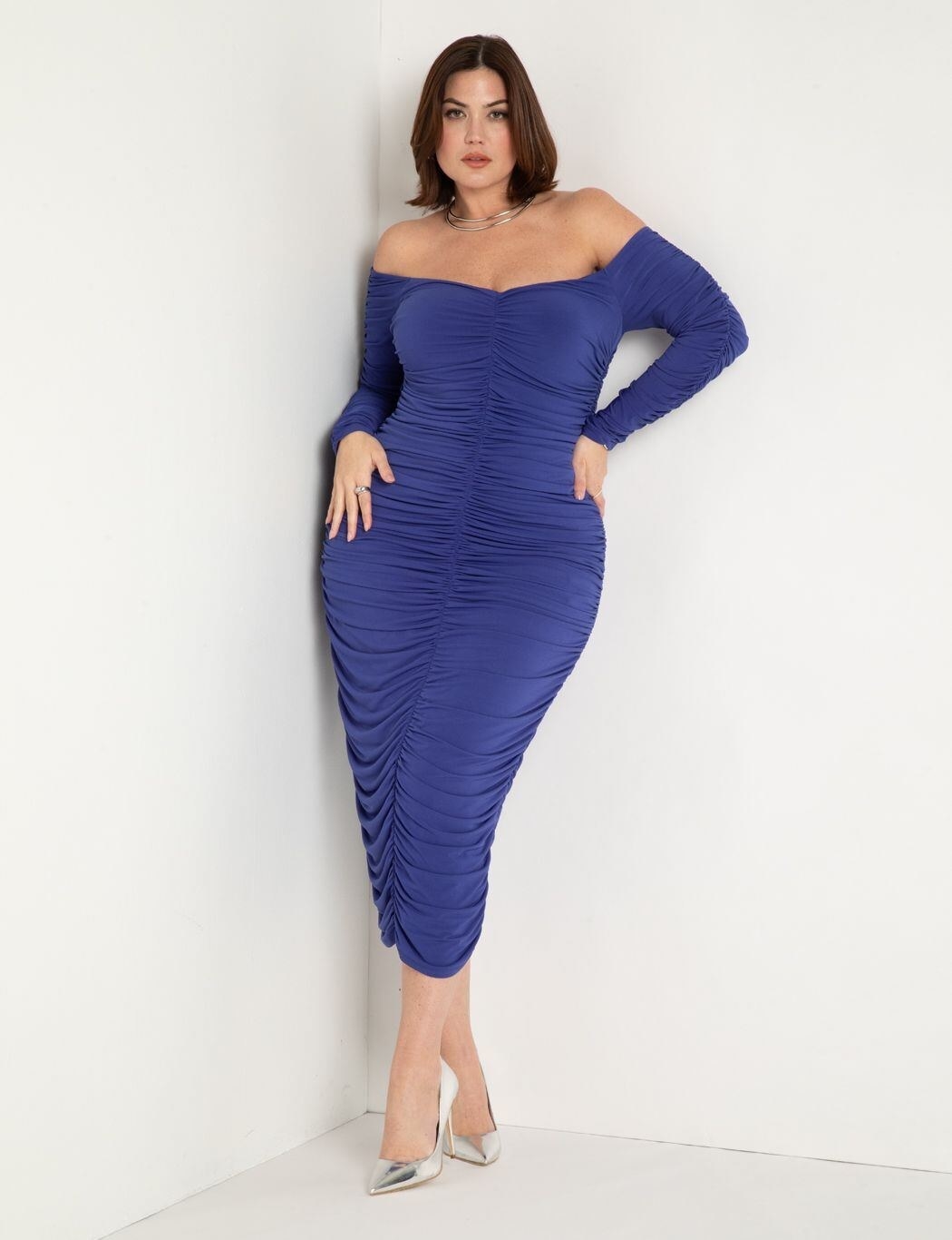model wearing dark blue off-shoulder midi dress