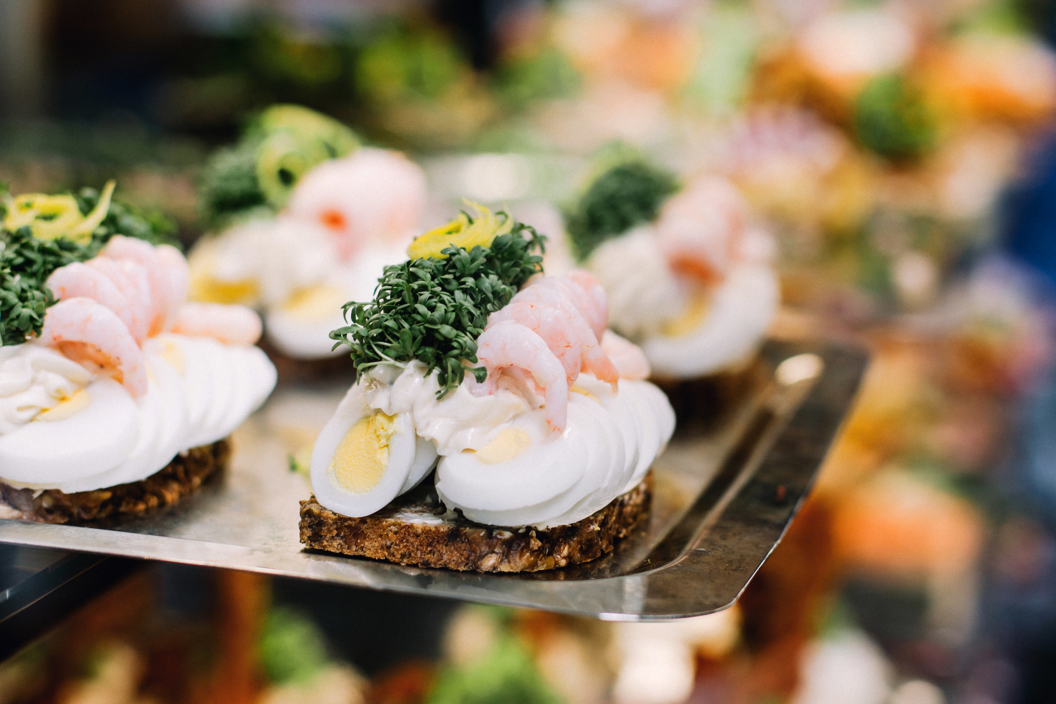 Open-faced sandwiches on a ceramic plate in Copenhagen