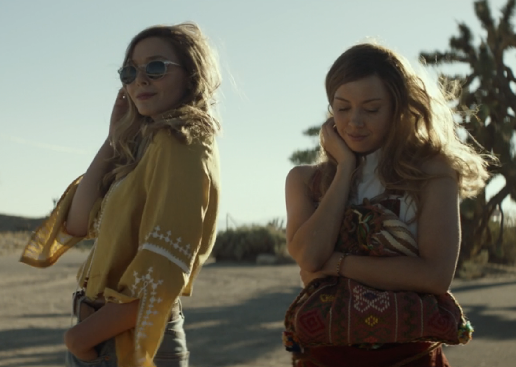 closeup of two friends in the desert