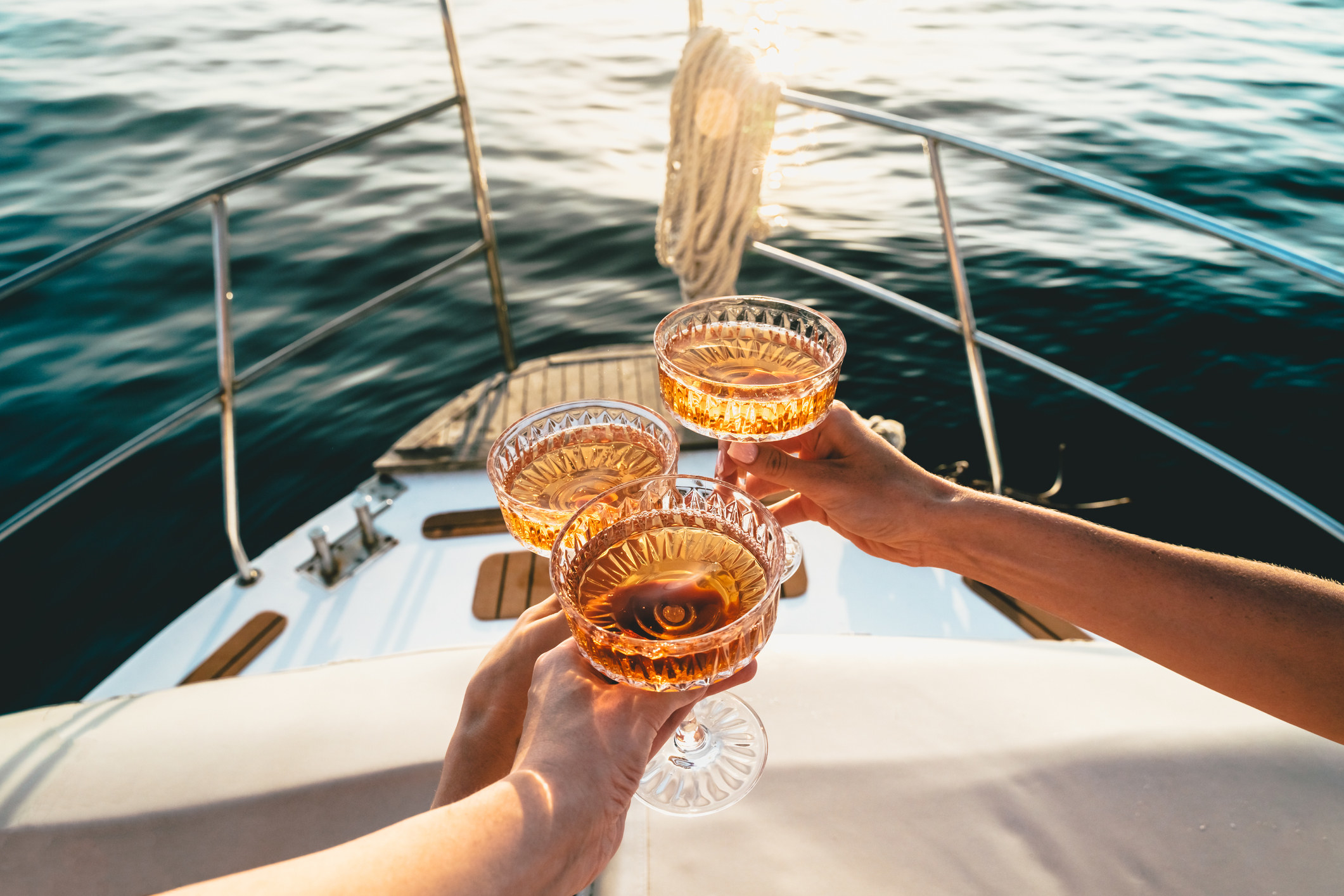 People clinking glasses on a boat