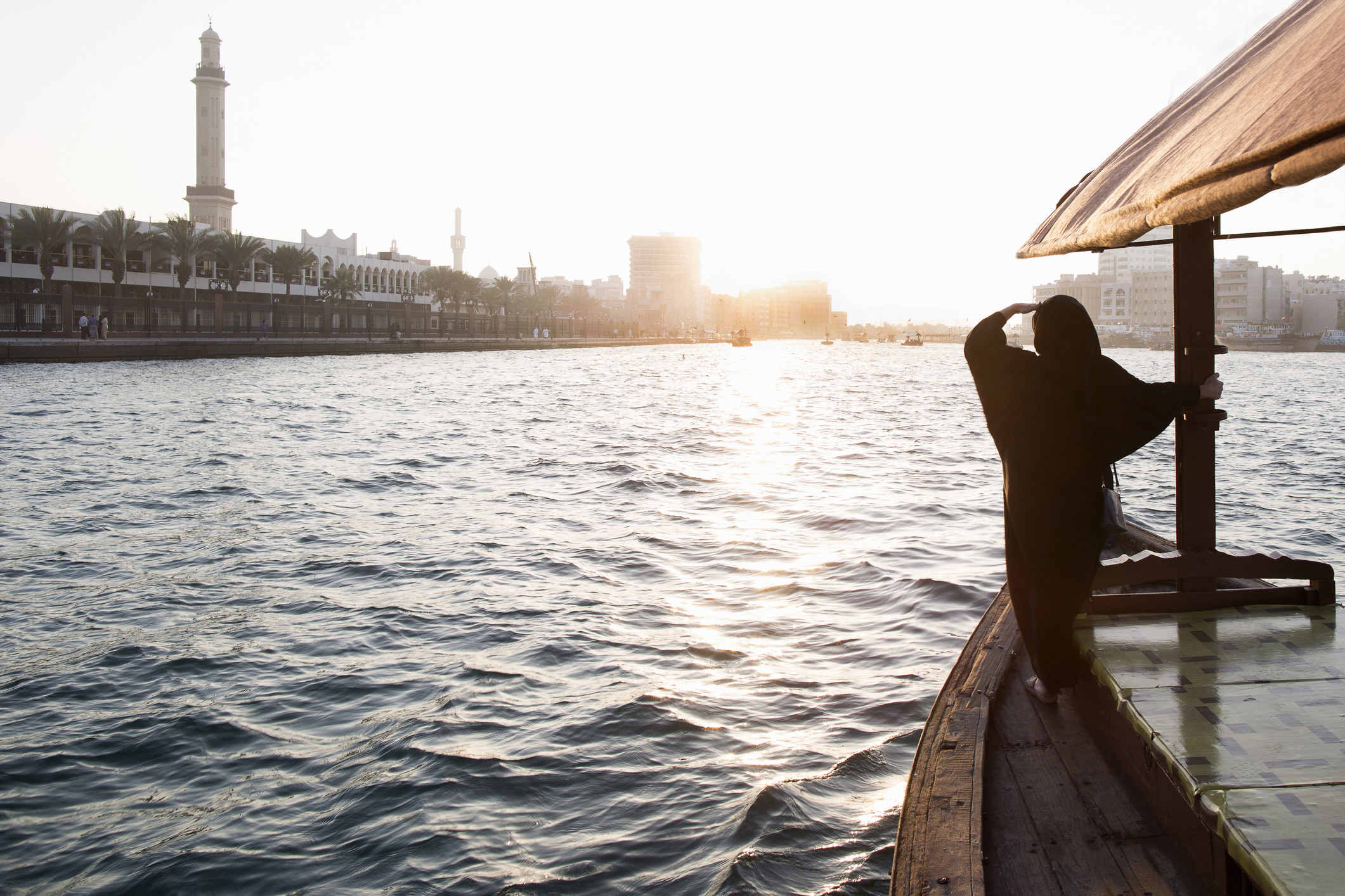 A woman on a boat in Dubai Creek