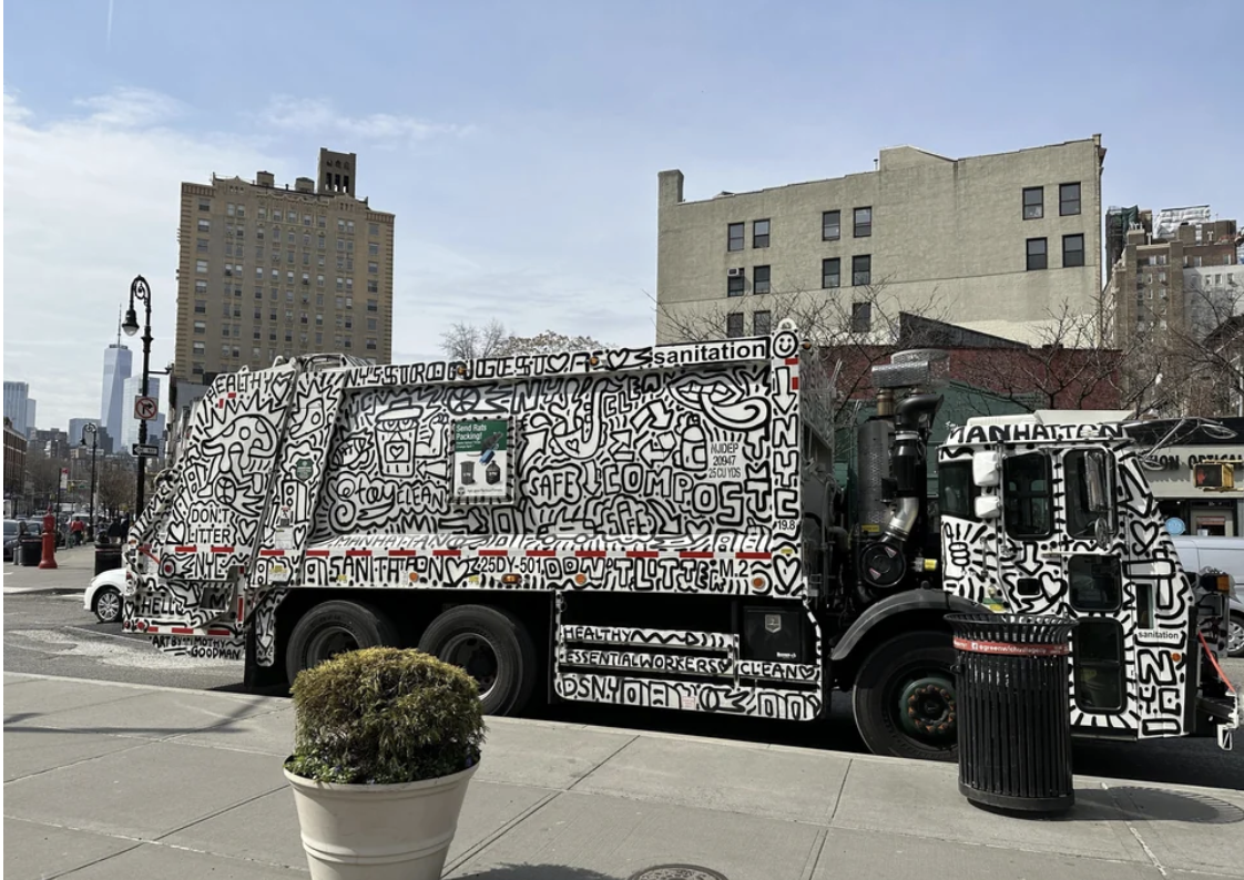 A pop art-painted garbage truck