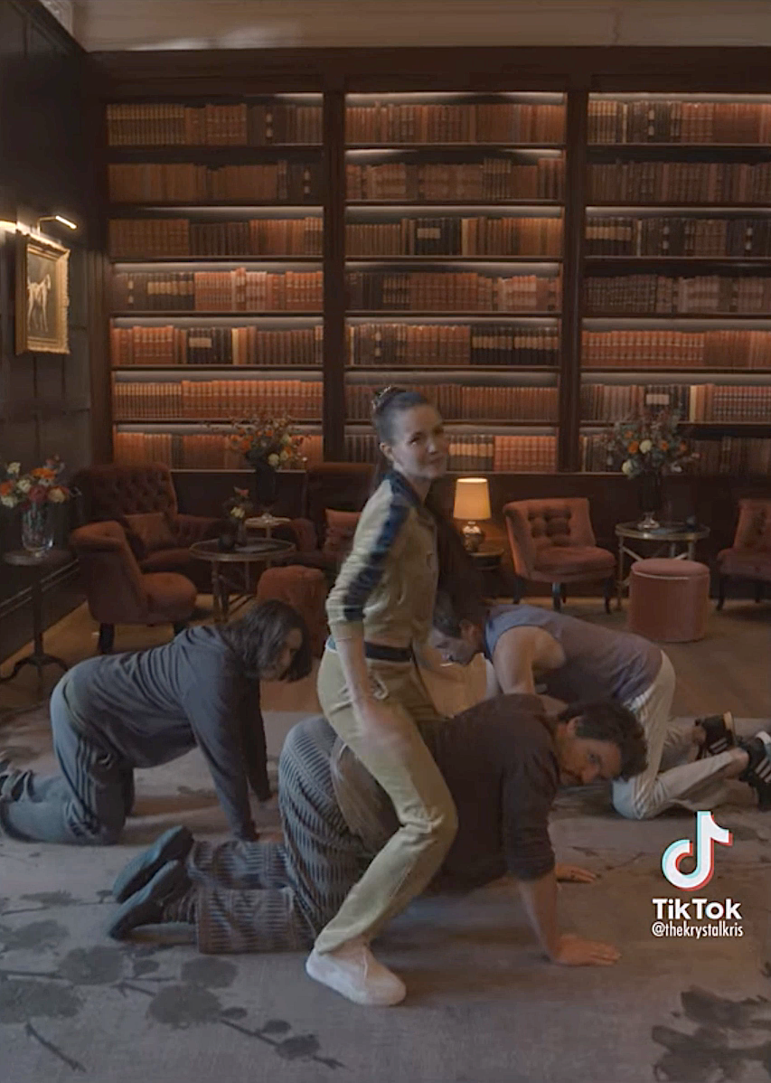 People performing a dance in a library on TikTok