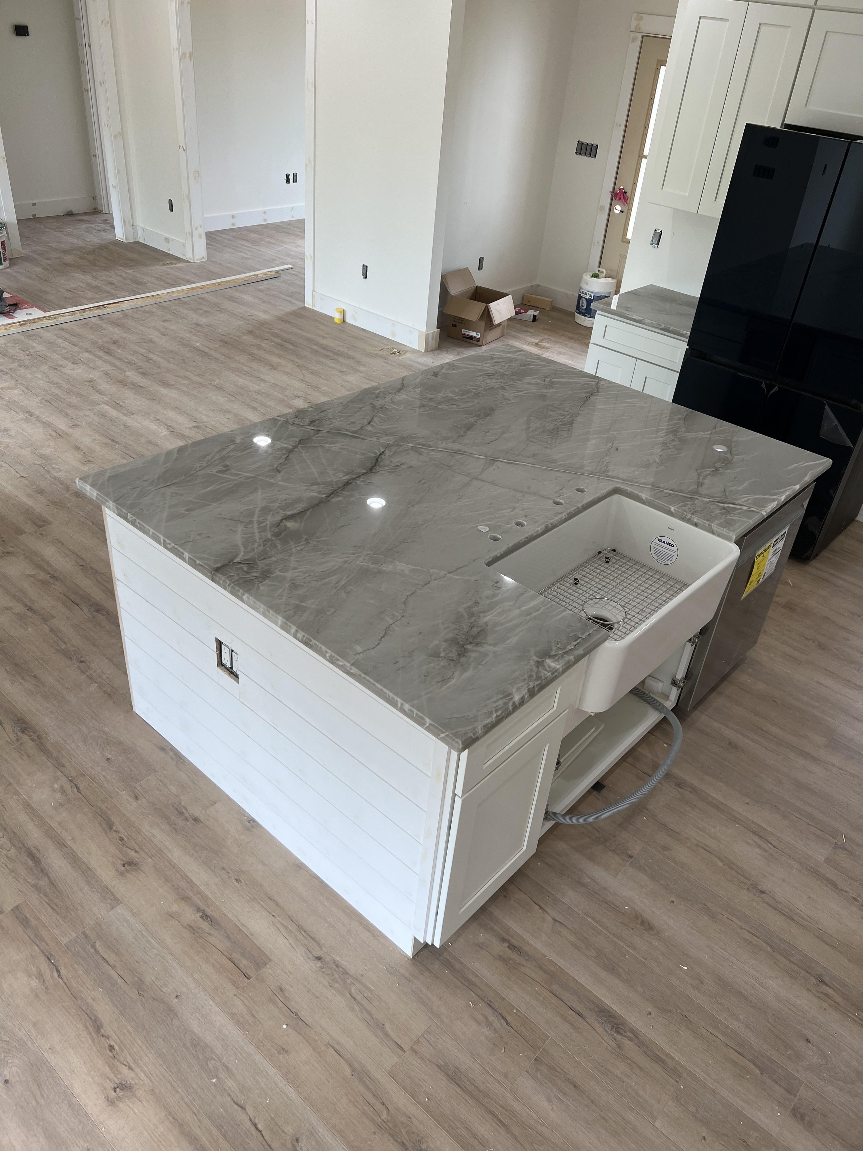installing marble countertop in a newly-renovated kitchen