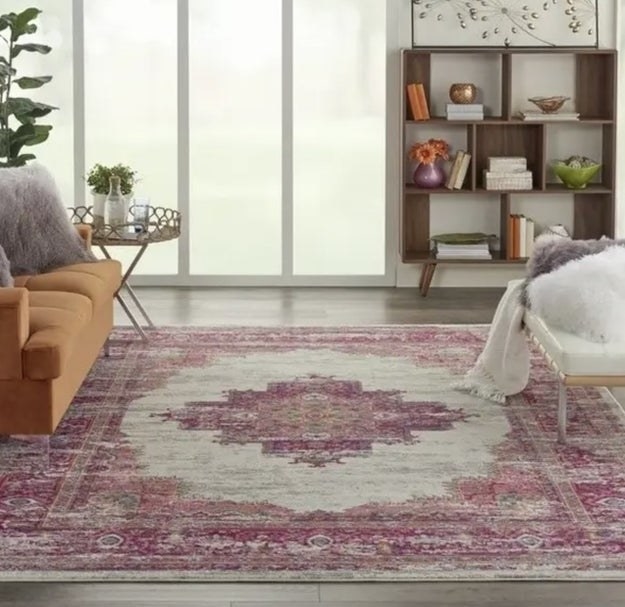 The accent rug on the floor