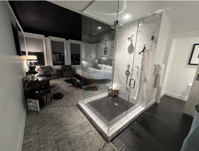 A shower in the middle of the living room