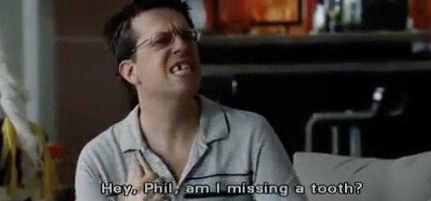 A scene from &quot;The Hangover&quot; where Stu smiles with a visibly missing tooth and asks &quot;Hey, Phil, am I missing a tooth?&quot;
