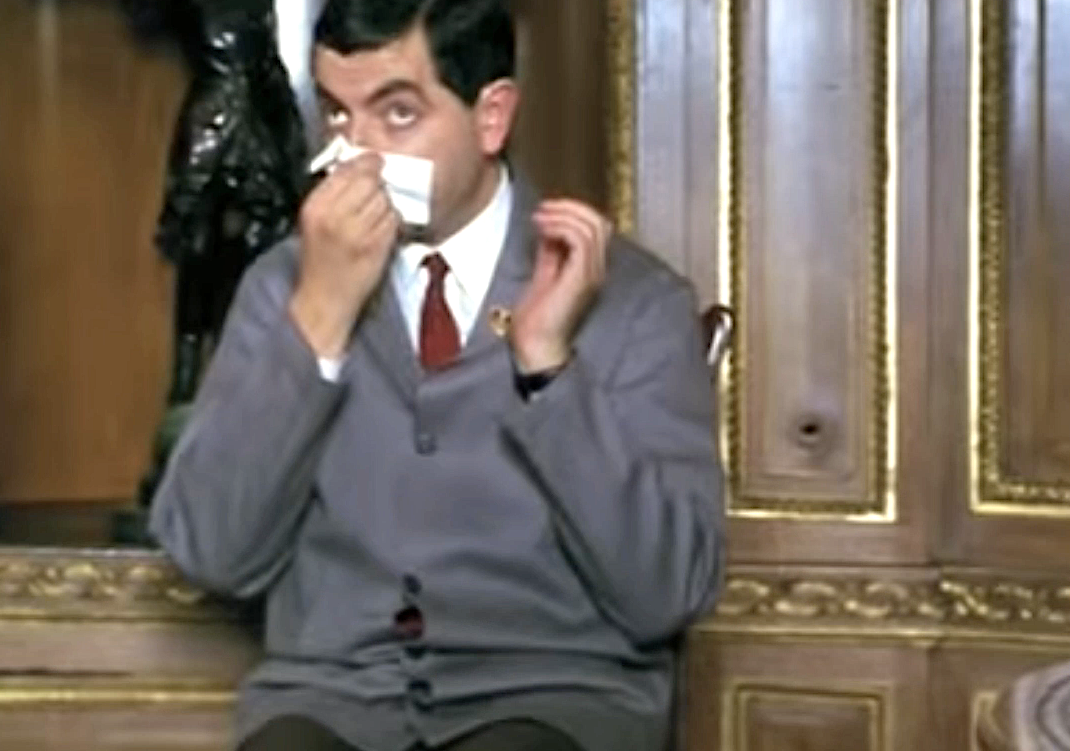 A man blowing his nose